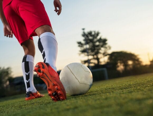 football player playing ball in the outdoor stadium. Cei mai buni fotbaliști din lume în 2023